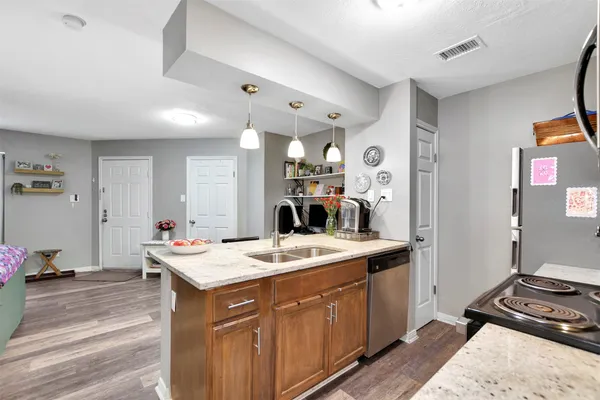 a kitchen with a stove and a microwave
