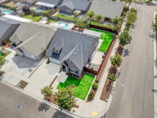 a work room with furniture a desk and chair with wooden floor