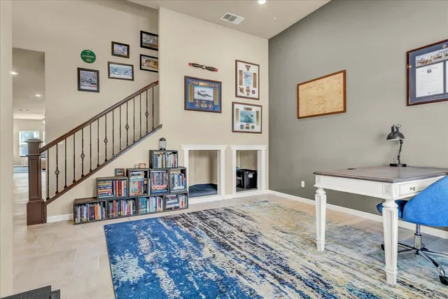 a kitchen with stainless steel appliances granite countertop a sink and a stove