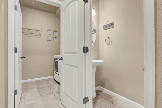 a kitchen with stainless steel appliances kitchen island granite countertop a sink and cabinets