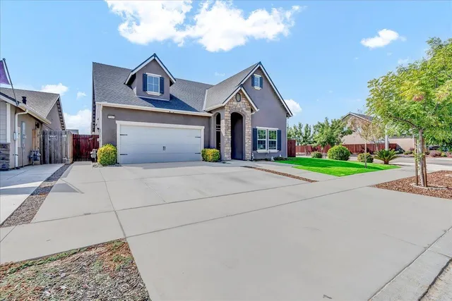 a house with yard in front of it