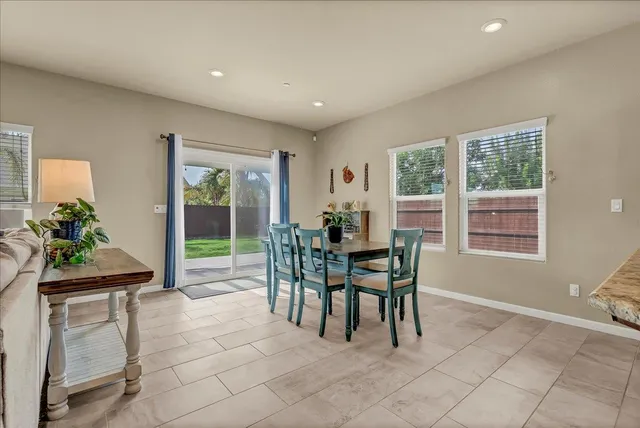 a room with a bed and a large window