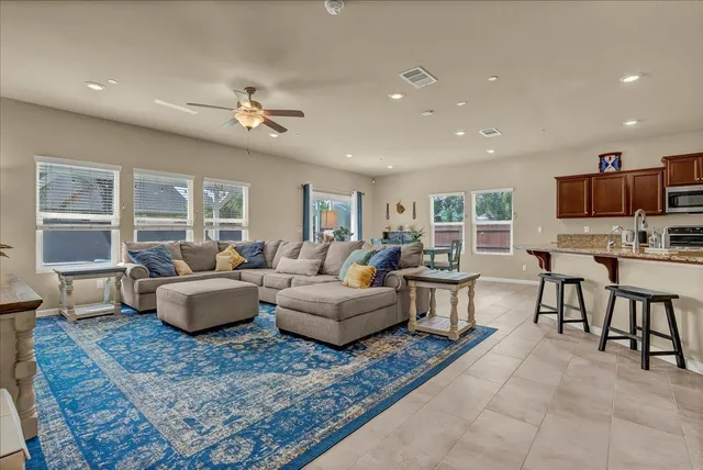 a bedroom with a bed and painting on the wall