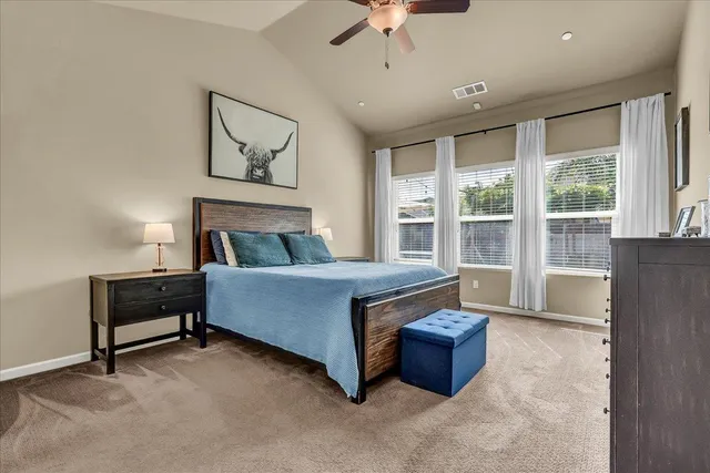 a bathroom with a granite countertop shower a toilet and a sink