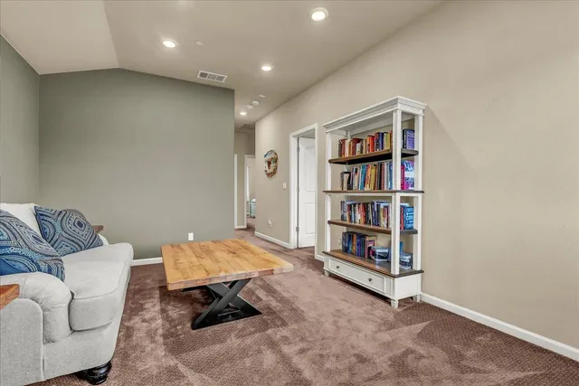 a view of a house with backyard sitting area and garden