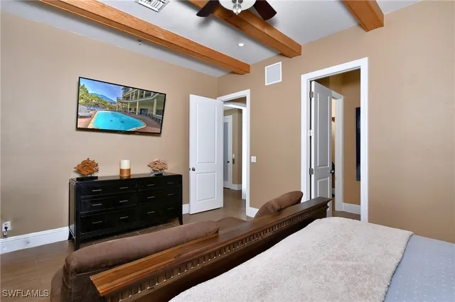 a bedroom with a bed and a dresser