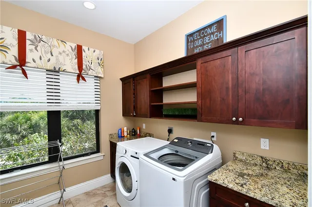 a kitchen that has a sink and a stove in it