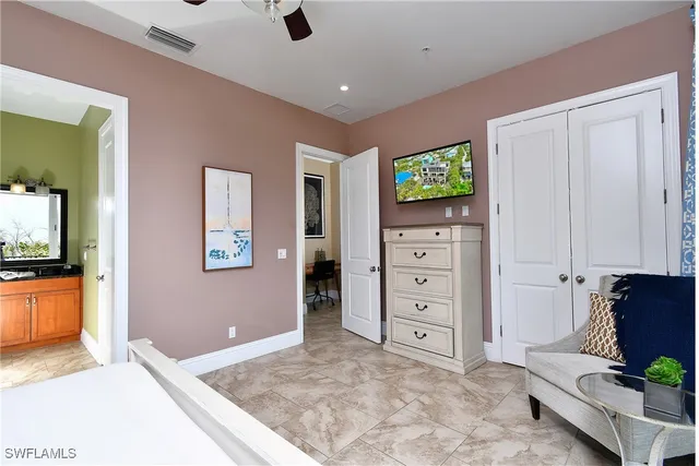 a view of room with window and a flat screen tv