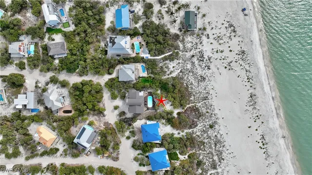 an aerial view of residential houses with outdoor space