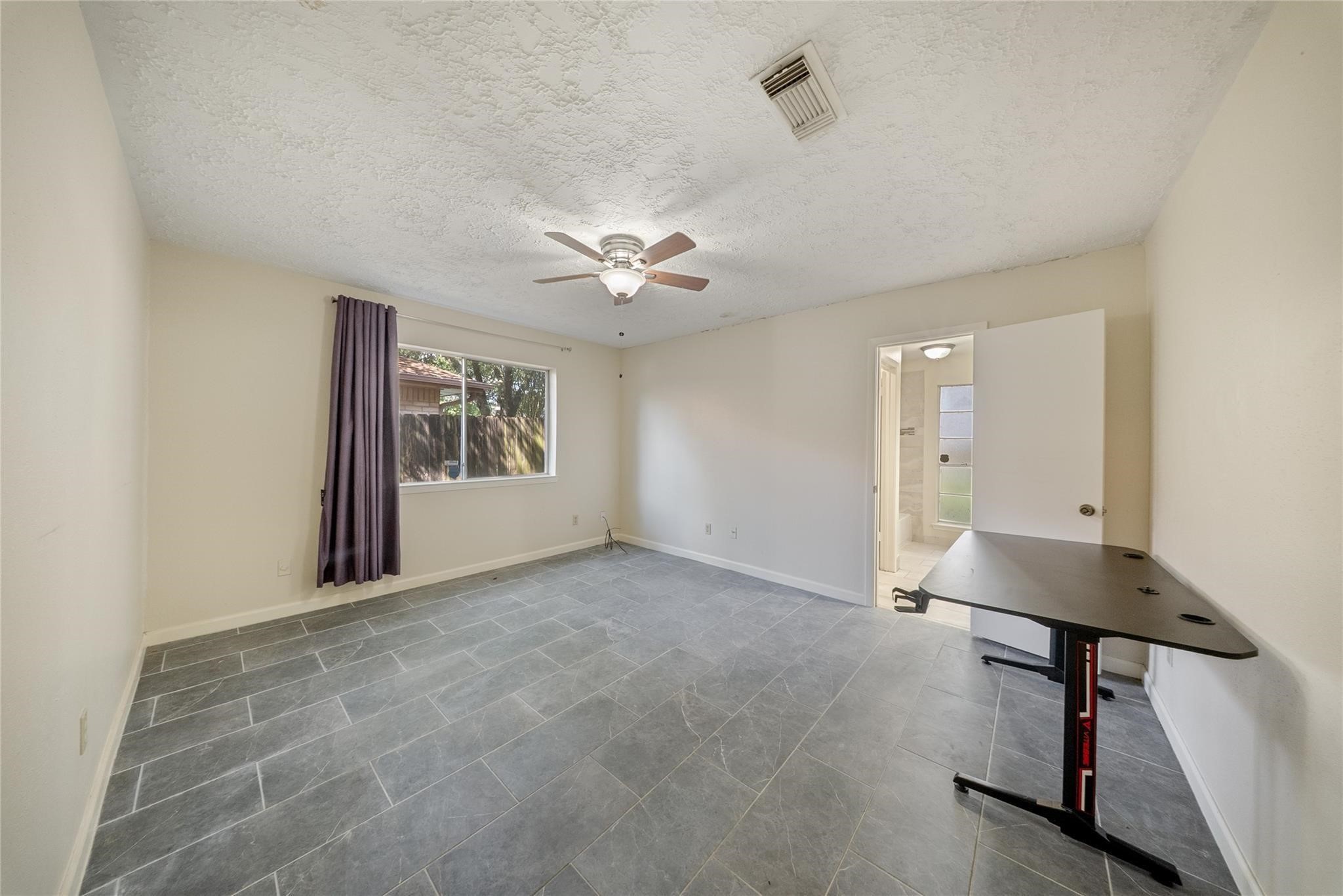 15738 Tammany Lane Houston, TX 77082 - Photo 15 of 22 a view of an empty room with a window