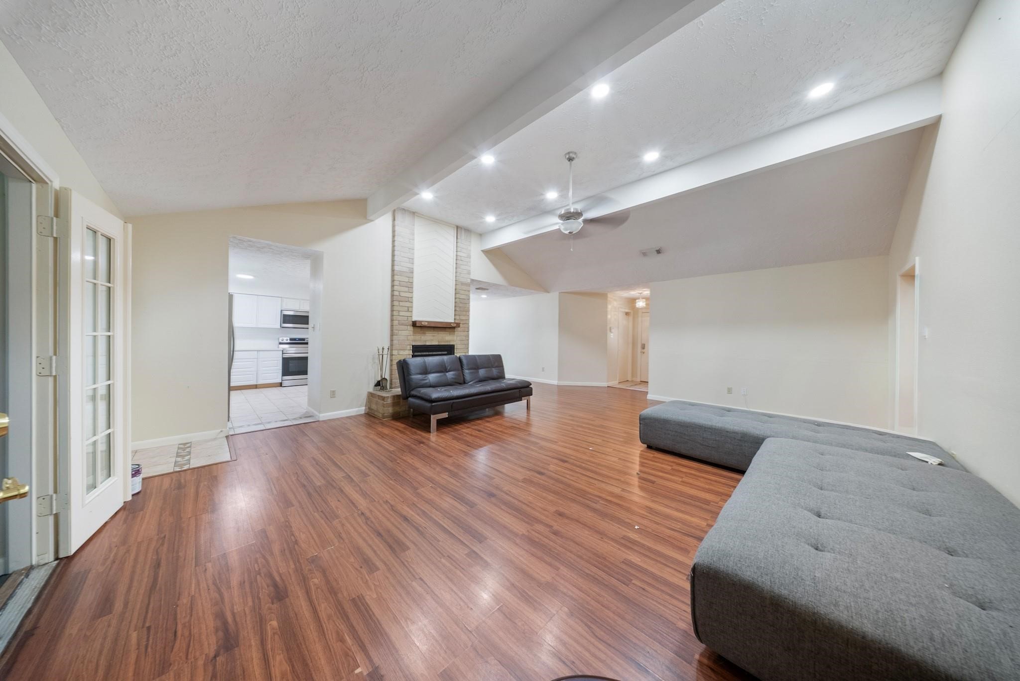 15738 Tammany Lane Houston, TX 77082 - Photo 19 of 22 a living room with furniture and a wooden floor