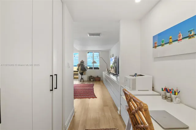 a workspace with furniture and a window