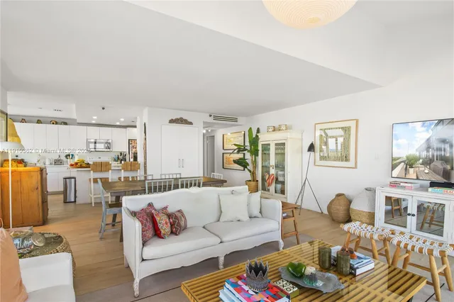 a kitchen with stainless steel appliances kitchen island granite countertop a sink and cabinets