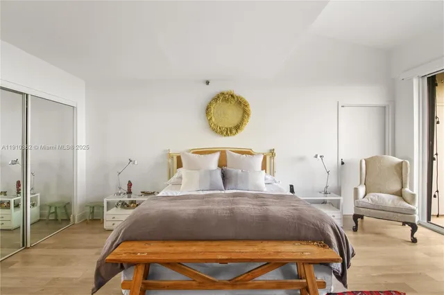 a bathroom with a granite countertop sink toilet mirror and shower
