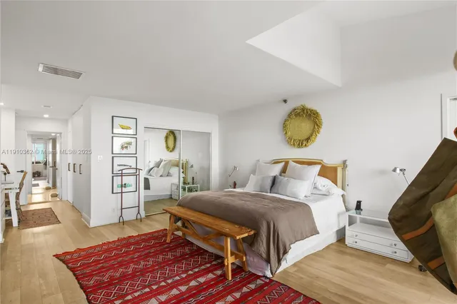 a view of a hallway with workspace and a couch