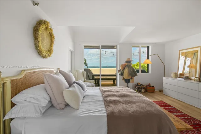 a bedroom with a bed furniture and a book shelf