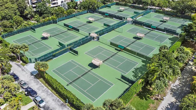 an aerial view of multiple houses with yard