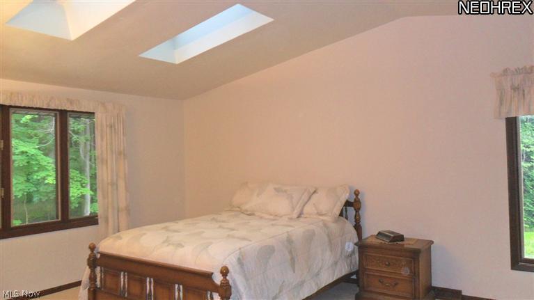 12446 Woodin Road Chardon, OH 44024 - Photo 12 of 19 Enjoy the skylights that open to let a cool breeze in while sleeping in this master bedroom.