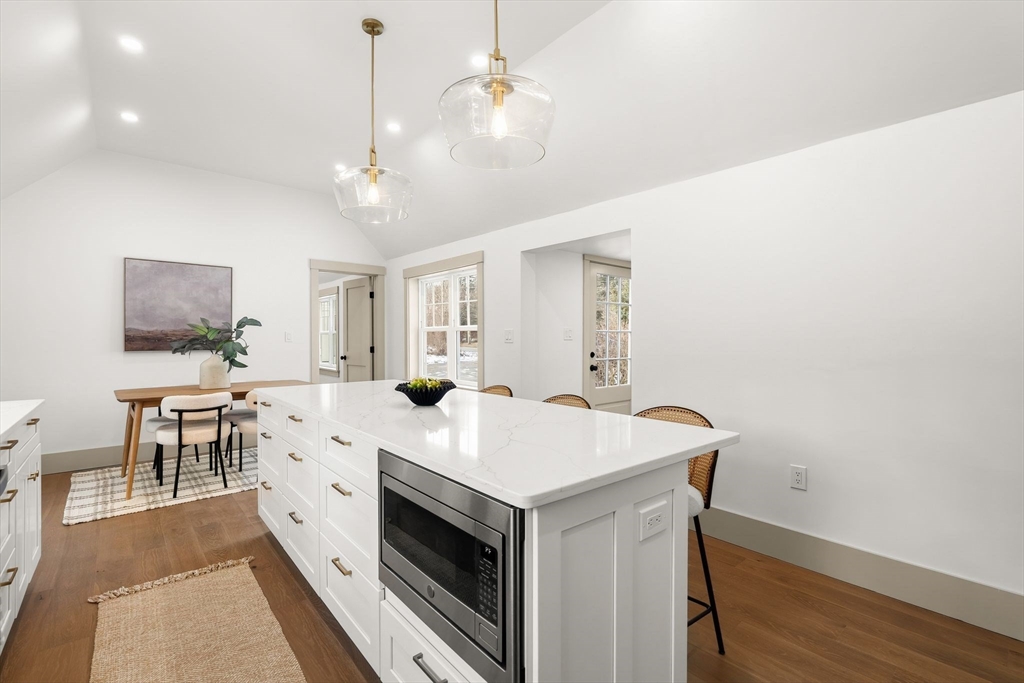 118 Hanover Street Hanover, MA 02339 - Photo 12 of 41 a view of kitchen with sink microwave and dining table