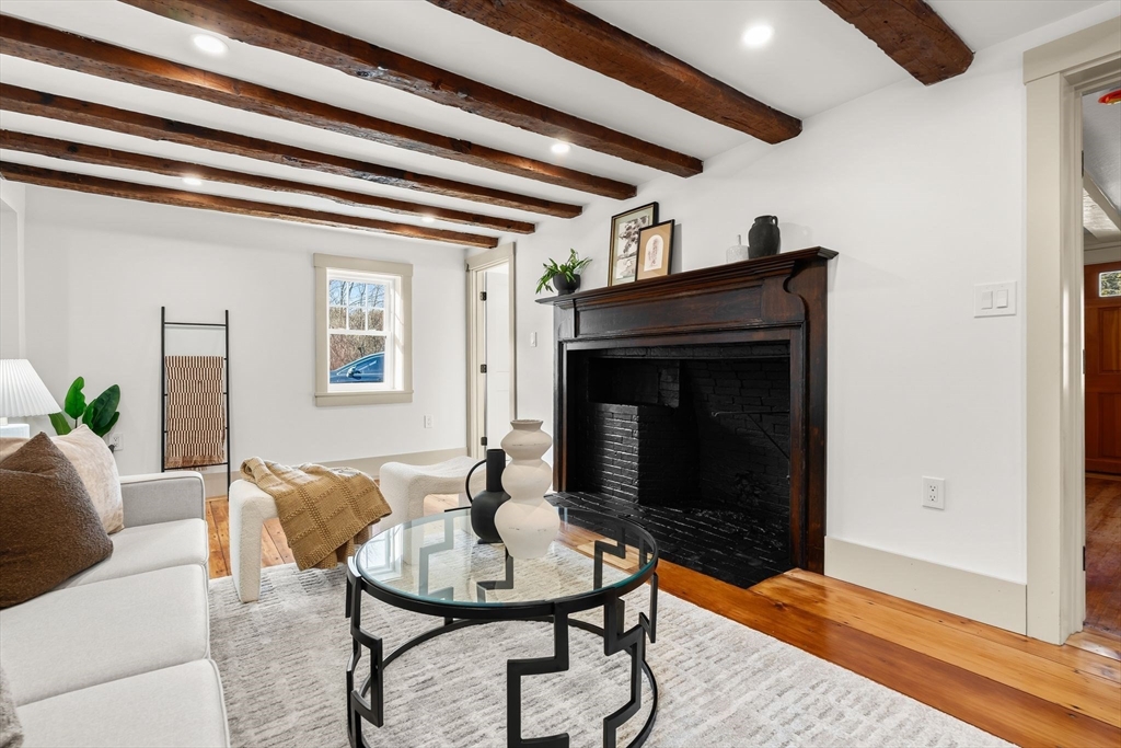 118 Hanover Street Hanover, MA 02339 - Photo 19 of 41 a living room with furniture and a fireplace