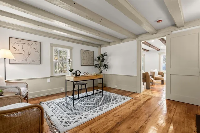 a living room with furniture and a table