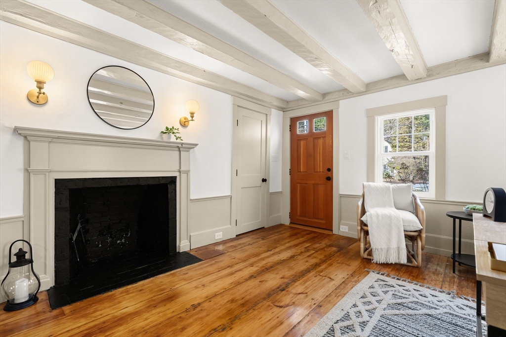 118 Hanover Street Hanover, MA 02339 - Photo 23 of 41 a living room with furniture and a fireplace