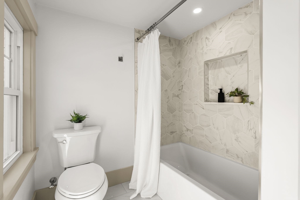 118 Hanover Street Hanover, MA 02339 - Photo 26 of 41 a white toilet sitting next to a bath tub