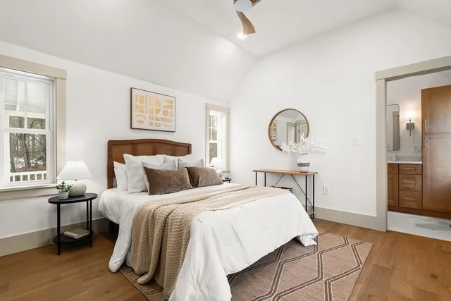 a bedroom with a bed and a table