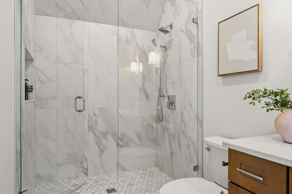 118 Hanover Street Hanover, MA 02339 - Photo 32 of 41 a bathroom with a sink a toilet and shower