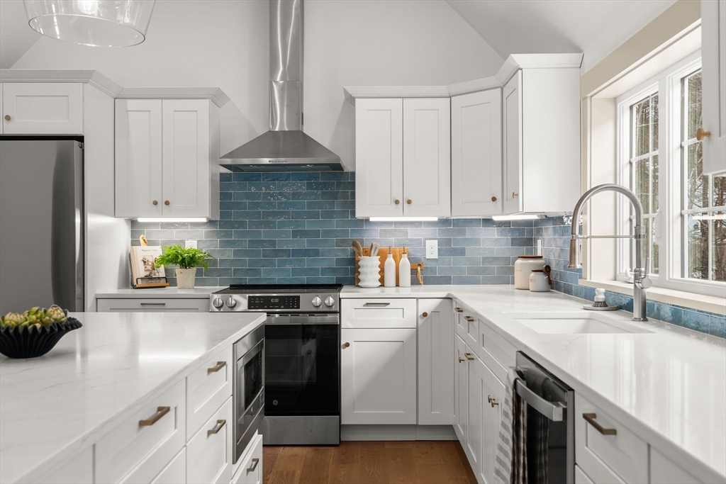 118 Hanover Street Hanover, MA 02339 - Photo 9 of 41 a kitchen with stainless steel appliances granite countertop a sink stove refrigerator and cabinets