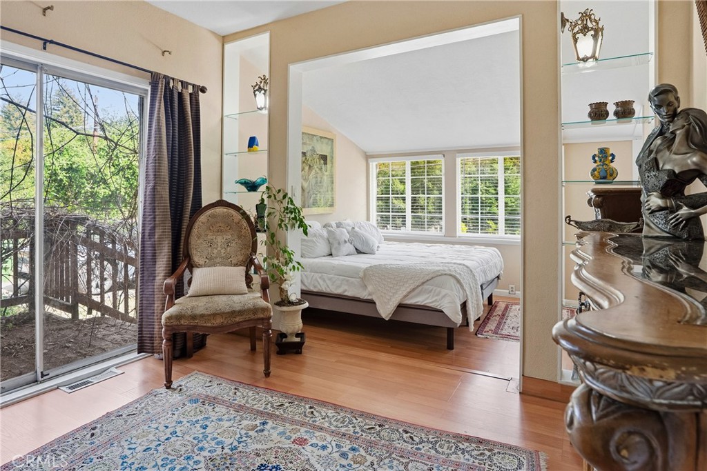 6701 East Zayante Road Felton, CA 95018 - Photo 21 of 44 a bedroom with a bed and wooden floor