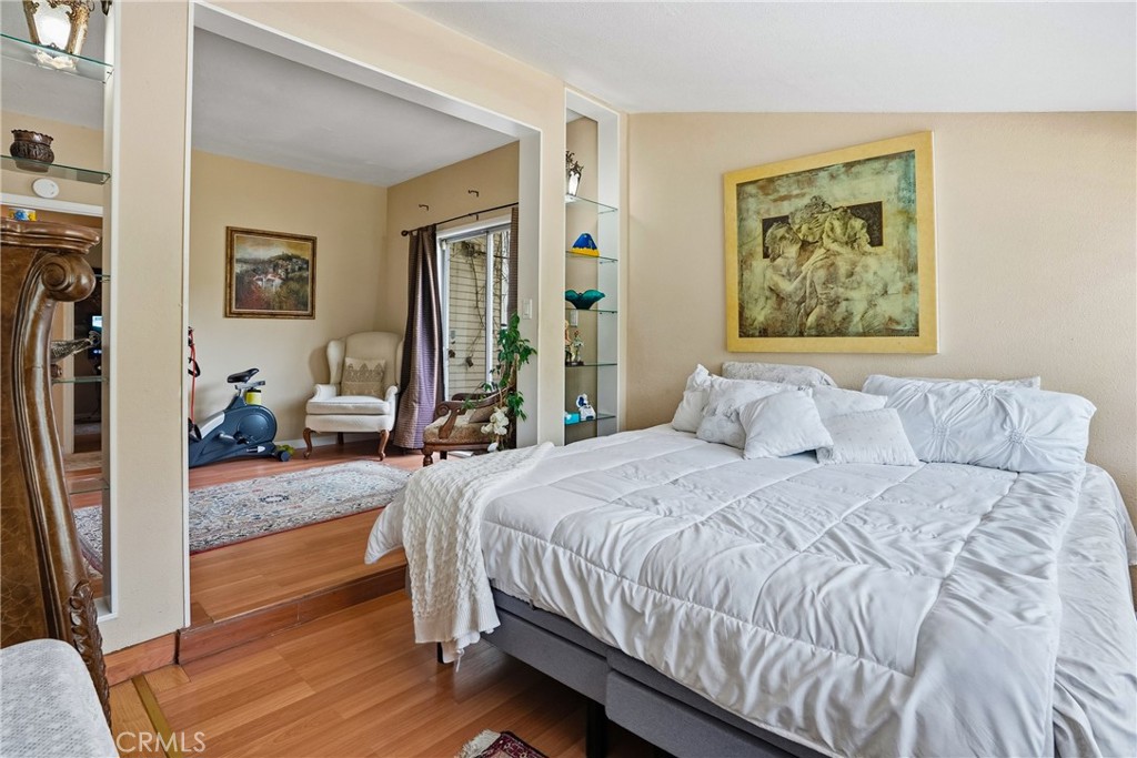 6701 East Zayante Road Felton, CA 95018 - Photo 22 of 44 a bedroom with a bed and wooden floor