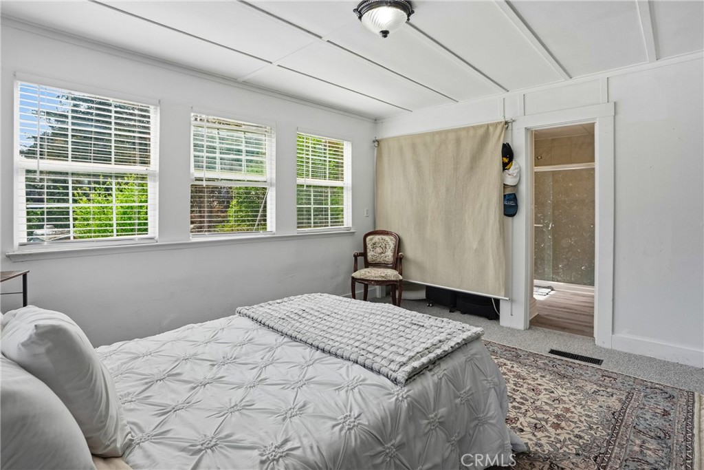 6701 East Zayante Road Felton, CA 95018 - Photo 31 of 44 a bedroom with a large bed and a window