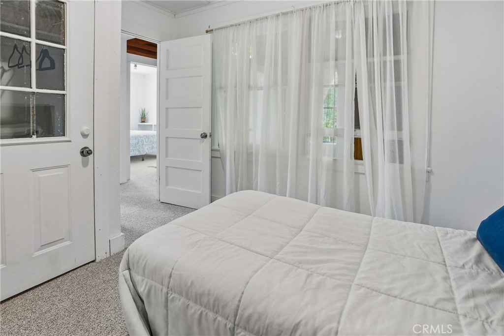 6701 East Zayante Road Felton, CA 95018 - Photo 35 of 44 a bedroom with a bed and a window