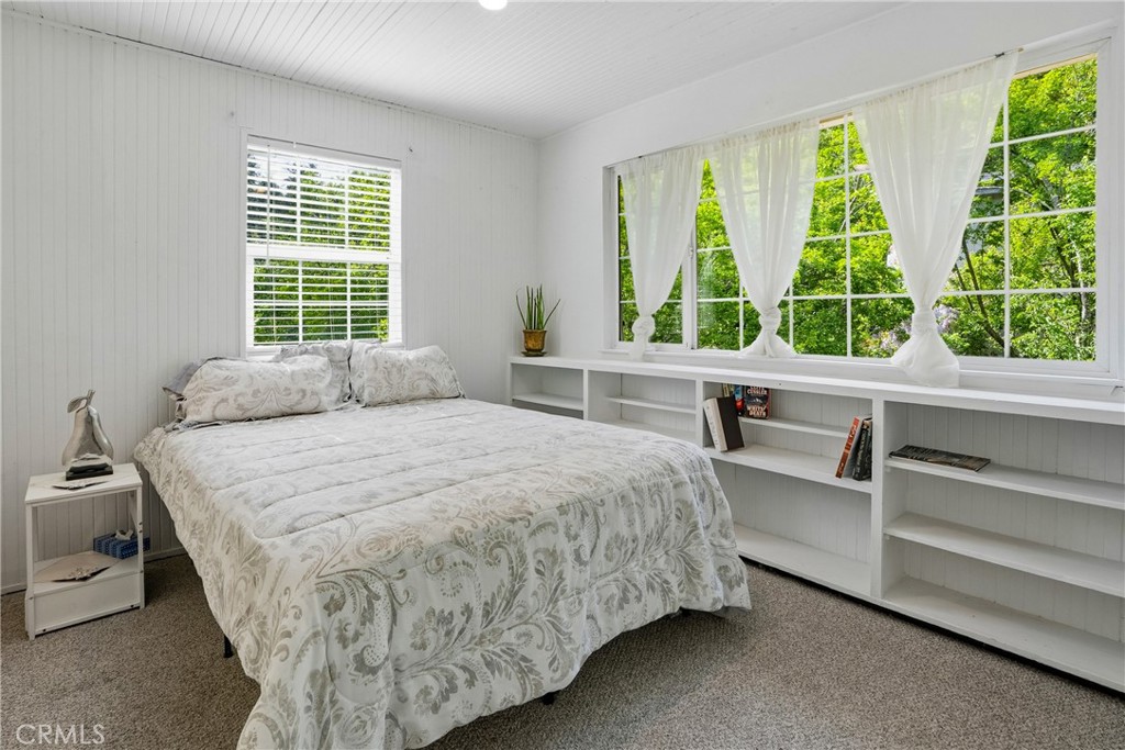 6701 East Zayante Road Felton, CA 95018 - Photo 36 of 44 a bed sitting in a bedroom next to a window