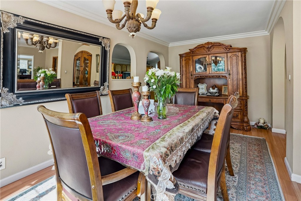 6701 East Zayante Road Felton, CA 95018 - Photo 10 of 44 a view of a dining room with furniture a chandelier and wooden floor
