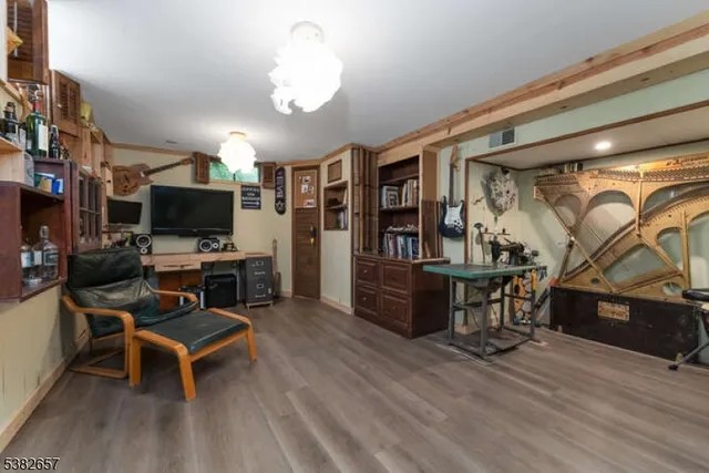 a view of a livingroom with furniture and a flat screen tv