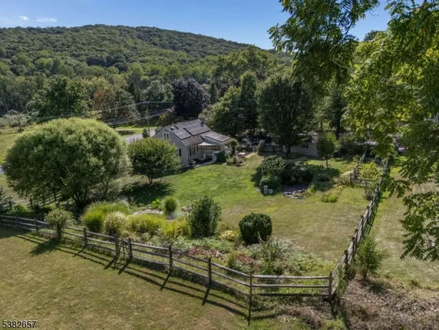 a view of a house with a yard and a large pool