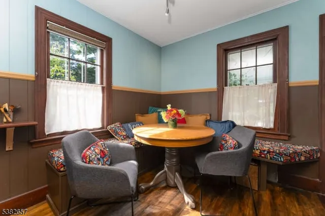 a dining room with furniture and window