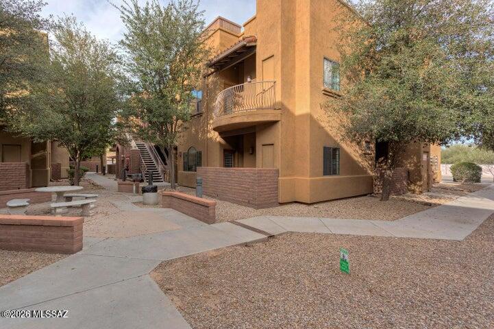 2018 East River Road, Unit 102 Tucson, AZ 85718 - Photo 1 of 25 a front view of a house with a outdoor space