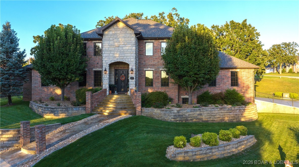 5745 Tree Leaf Court Osage Beach, MO 65065 - Photo 42 of 49 Immaculate curb appeal. Irrigation in place as wel