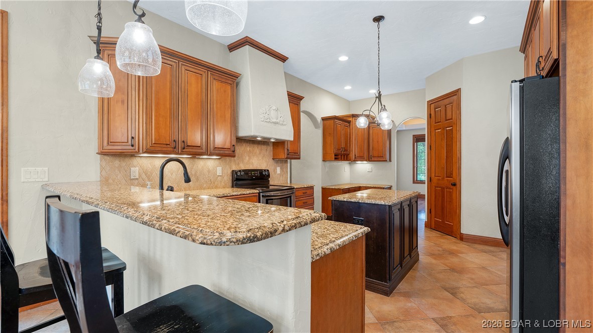 5745 Tree Leaf Court Osage Beach, MO 65065 - Photo 10 of 49 Custom cabinets, granite countertops, good size is