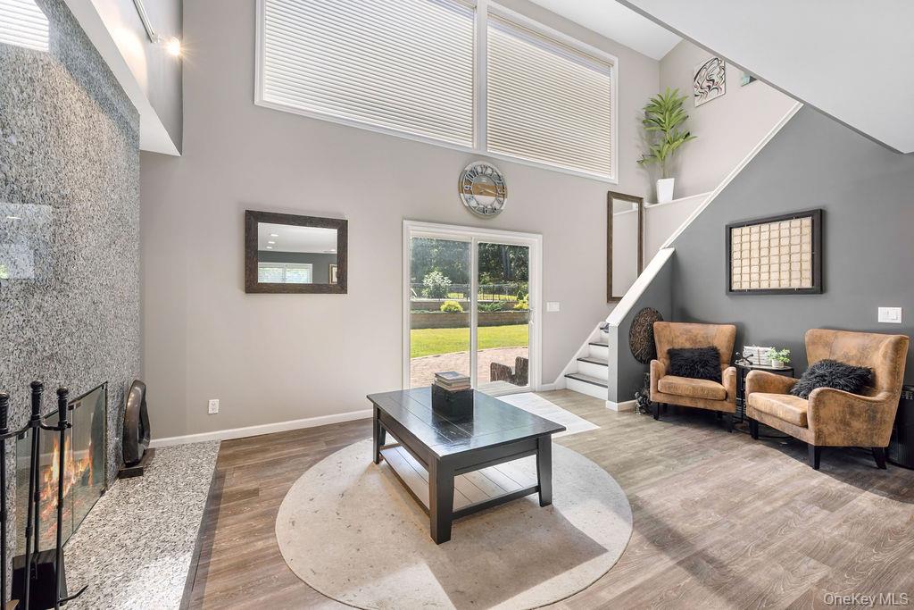 30 Lone Oak Path Smithtown, NY 11787 - Photo 11 of 39 a living room with furniture and a window