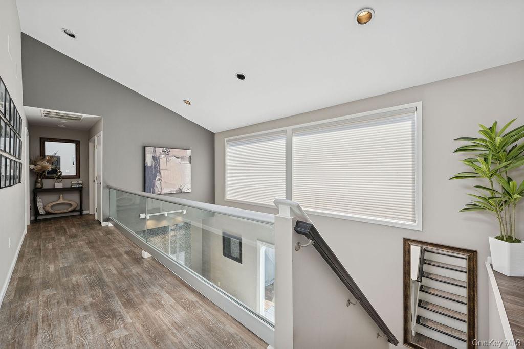 30 Lone Oak Path Smithtown, NY 11787 - Photo 12 of 39 a view of a hallway with entryway and stairs