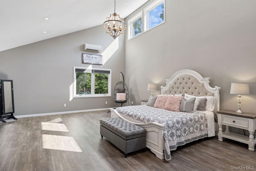 30 Lone Oak Path Smithtown, NY 11787 - Photo 16 of 39 a bedroom with a bed couch and window