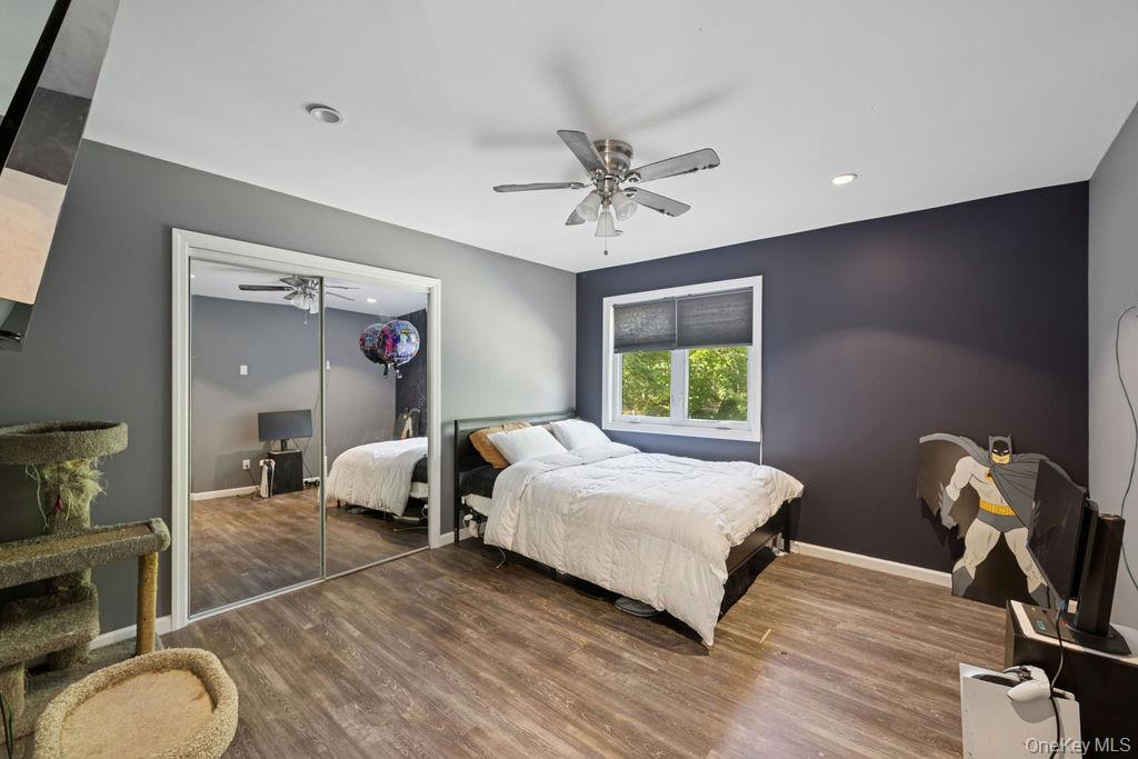 30 Lone Oak Path Smithtown, NY 11787 - Photo 21 of 39 a bed room with a bed and dresser