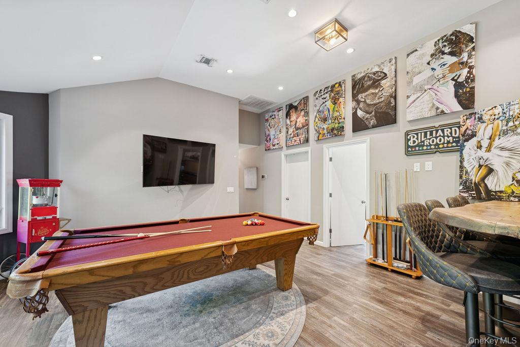 30 Lone Oak Path Smithtown, NY 11787 - Photo 25 of 39 a room with furniture and wooden floor