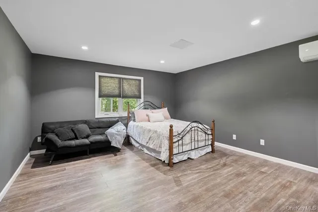 a bed room with furniture and a window