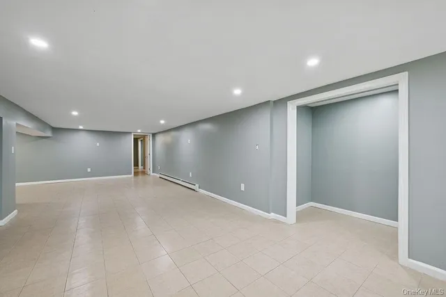 an empty room with wooden floor