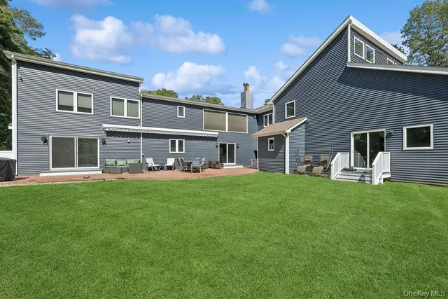 a front view of house with yard and porch